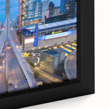 Close-up of a black wall art depicting Boston's skyline with textured, colorful art on a framed canvas.