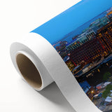 Art deco poster of Boston skyline in muted blue and gold tones on rolled canvas.