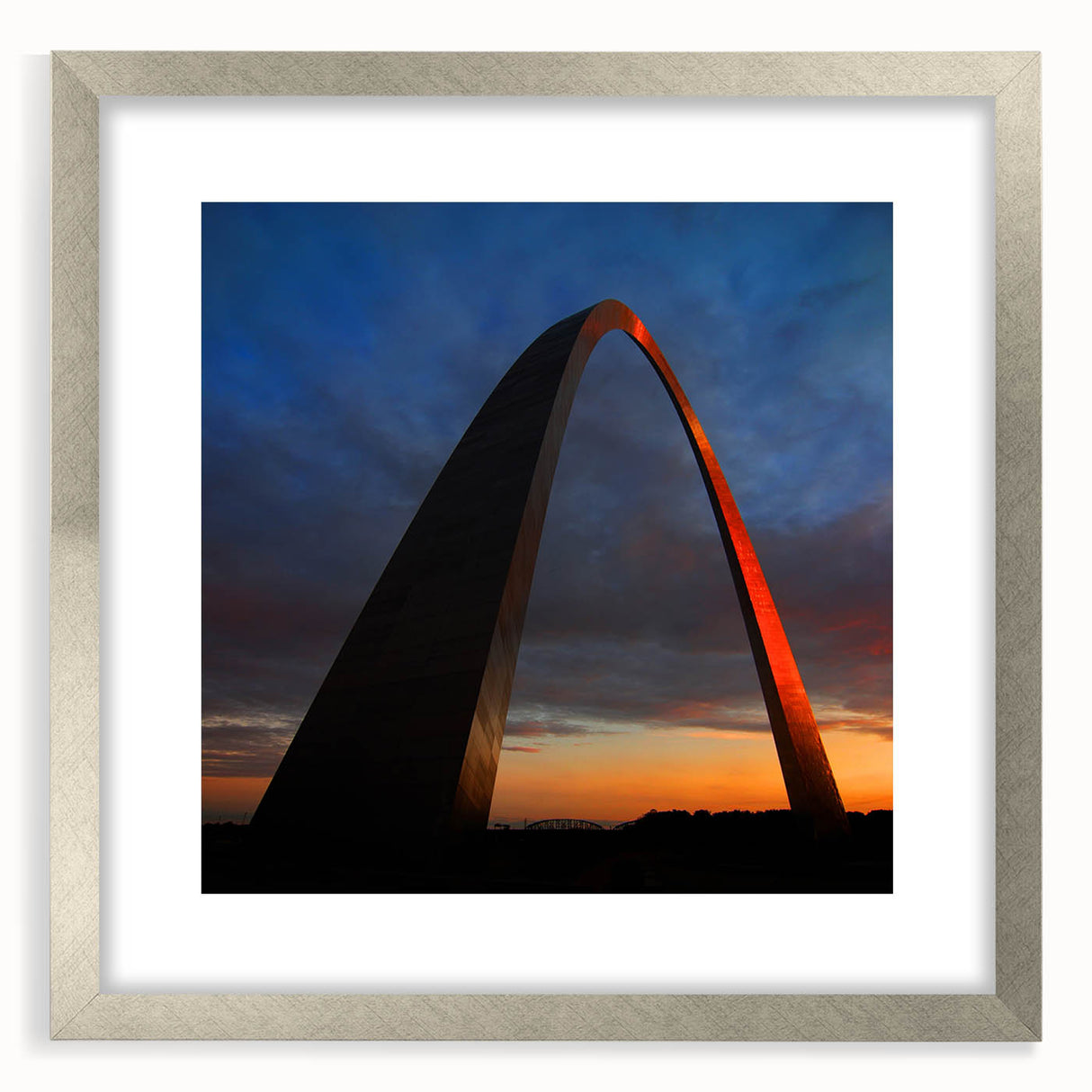 Textured art of abstract St. Louis skyline in muted blue and gray, framed in silver, ideal for modern bedroom ambiance.