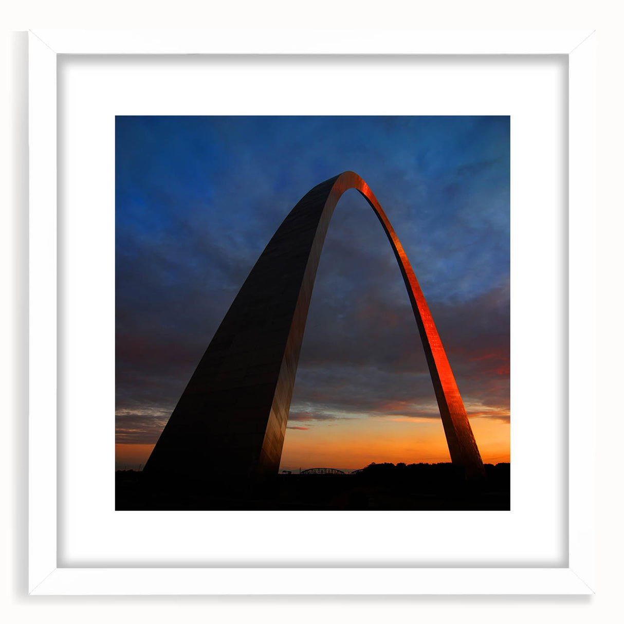 Abstract art print of St. Louis skyline in muted blue tones, framed with a white mat, suitable for dining room decor.