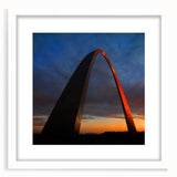 Abstract art print of St. Louis skyline in muted blue tones, framed with a white mat, suitable for dining room decor.