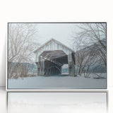 Art deco poster depicting serene Vermont landscape in muted green and blue hues, framed in white acrylic.