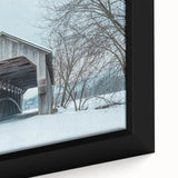 Close-up of a black wall art piece depicting a textured Vermont scenery in colorful art style on framed canvas.