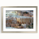 Textured art depicting abstract Yellowstone scenery in muted earth tones on a framed silver mat, suitable for bedroom decor.