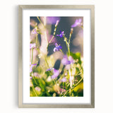 Textured art featuring abstract spring motifs in soft green and pink tones on a framed silver mat.