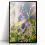 Large abstract wall art depicting spring themes in vibrant greens and pastels, framed in black acrylic.