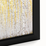 Close-up of a framed canvas showcasing vibrant abstract floral designs in shades of pink, teal, and gold, perfect for modern home decor enhancement.