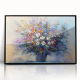 Framed acrylic artwork featuring vibrant abstract floral designs in shades of pink, blue, and green, set against a sleek black frame, ideal for modern home décor.