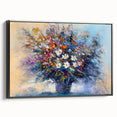 Framed canvas artwork showcasing abstract floral designs in vibrant colors, set against a sleek black frame, ideal for modern home decor. Perfect for enhancing living room aesthetics with a touch of elegance.