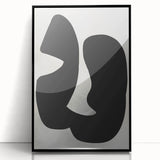 Framed abstract minimalist wall art in black acrylic, showcasing a sleek design that adds a modern touch to any interior décor, perfect for contemporary spaces.