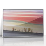 Framed abstract landscape artwork featuring soft pastel colors and fluid shapes, mounted in a sleek white frame, ideal for modern interior decor.