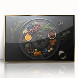 Large art print of assorted fruits in vibrant colors, framed in gold acrylic, mid-century modernist style.