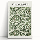 Stretched canvas artwork showcasing vibrant abstract floral designs in hues of pink, green, and blue, elegantly leaning against a neutral wall, perfect for home decor.