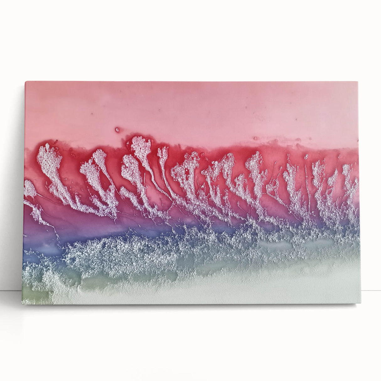 Abstract landscape canvas art featuring vibrant colors and flowing shapes, designed to enhance modern home decor. The artwork leans against a neutral wall, showcasing its unique texture and artistic depth. Perfect for adding a contemporary touch to living spaces.