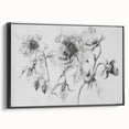 Framed abstract floral canvas art in black, showcasing vibrant colors and intricate designs, ideal for modern home decor and wall aesthetics.