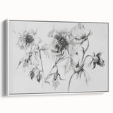 Framed canvas artwork showcasing an abstract floral design in vibrant colors, displayed at a slight angle against a white background, enhancing its modern aesthetic.