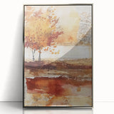 Mid-century modernist art depicting a stylized fall landscape in warm orange and brown tones on a silver-framed acrylic…