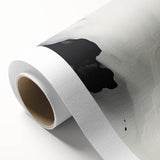 Abstract minimalist wall art design on rolled canvas, showcasing soft pastel colors and geometric shapes, packaged securely in a cardboard tube for delivery.