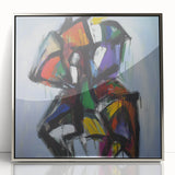Framed acrylic artwork showcasing a vibrant abstract design with colorful splatters and silver borders, perfect for contemporary home decor.