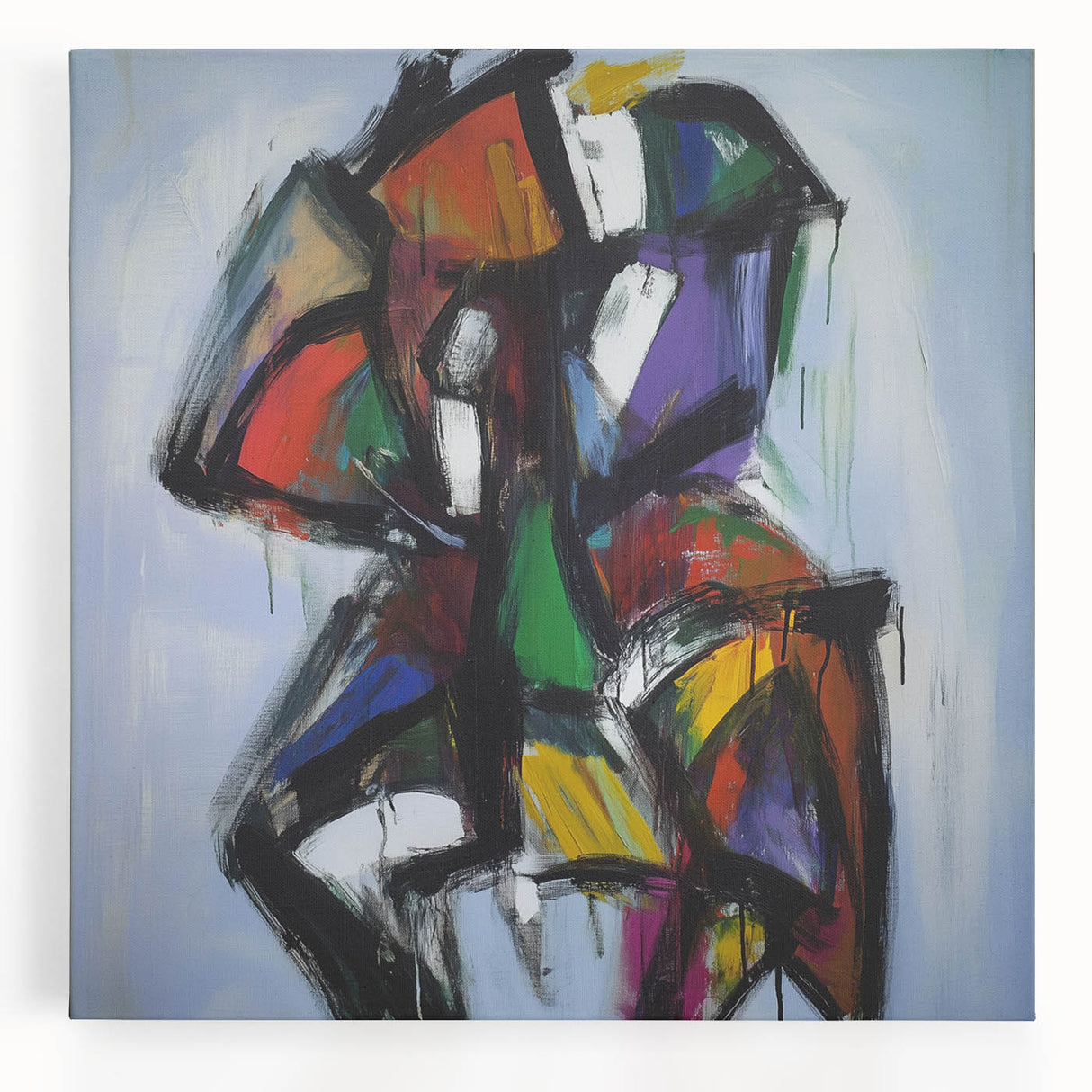 Abstract splatter art on stretched canvas, featuring vibrant colors including blues, reds, and yellows, perfect for modern home decor or office aesthetics.