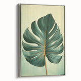Framed canvas wall art featuring an elegant design of colorful flowers and botanical leaves, showcased with a silver frame, perfect for home decor enhancement.