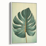 Framed canvas wall art showcasing a vibrant floral design with lush green leaves, set against a white background, perfect for enhancing home decor aesthetics.