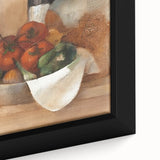 Close-up of a black framed canvas featuring textured, colorful art of assorted fruits.