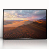Framed acrylic artwork showcasing a stunning desert dune landscape, featuring warm sand tones and a sleek black frame, perfect for modern home decor.