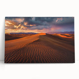 Stretched canvas artwork depicting serene sand dunes at sunset, showcasing warm tones of orange and gold, perfect for enhancing home decor with a tranquil vibe.