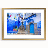 Textured art print of an abstract Moroccan landscape in earth tones, framed in gold, ideal for bedroom art.