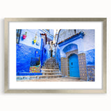 Abstract art print of a Moroccan landscape in muted earth tones on a framed silver mat, ideal for dining room decor.