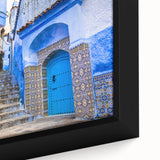 Black wall art featuring a textured Moroccan landscape in vibrant colors on a framed canvas, ideal for living room decor.