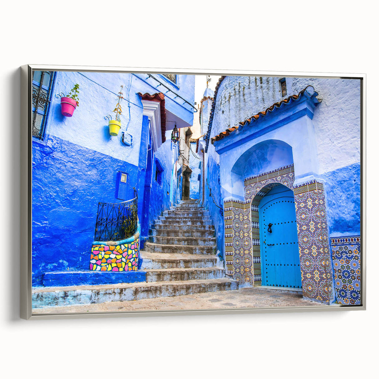 Vintage poster art of a Moroccan landscape on framed canvas, featuring vibrant colors against a black background.