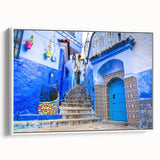 Framed canvas wall art featuring a vintage-style Moroccan landscape in muted earth tones, ideal for bedroom decor.