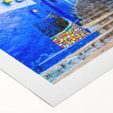 Art deco poster of a Moroccan landscape in earth tones on rolled canvas, suitable for dining room walls.