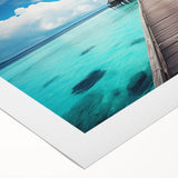 Art deco poster of a serene Maldives beach scene on rolled canvas, featuring soft blue and white tones.