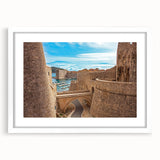 Textured abstract art print of a European Croatian scenery in muted earth tones, framed with a white mat.