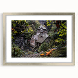 Extra large abstract art print of a textured European scenery in muted earth tones, framed in silver.
