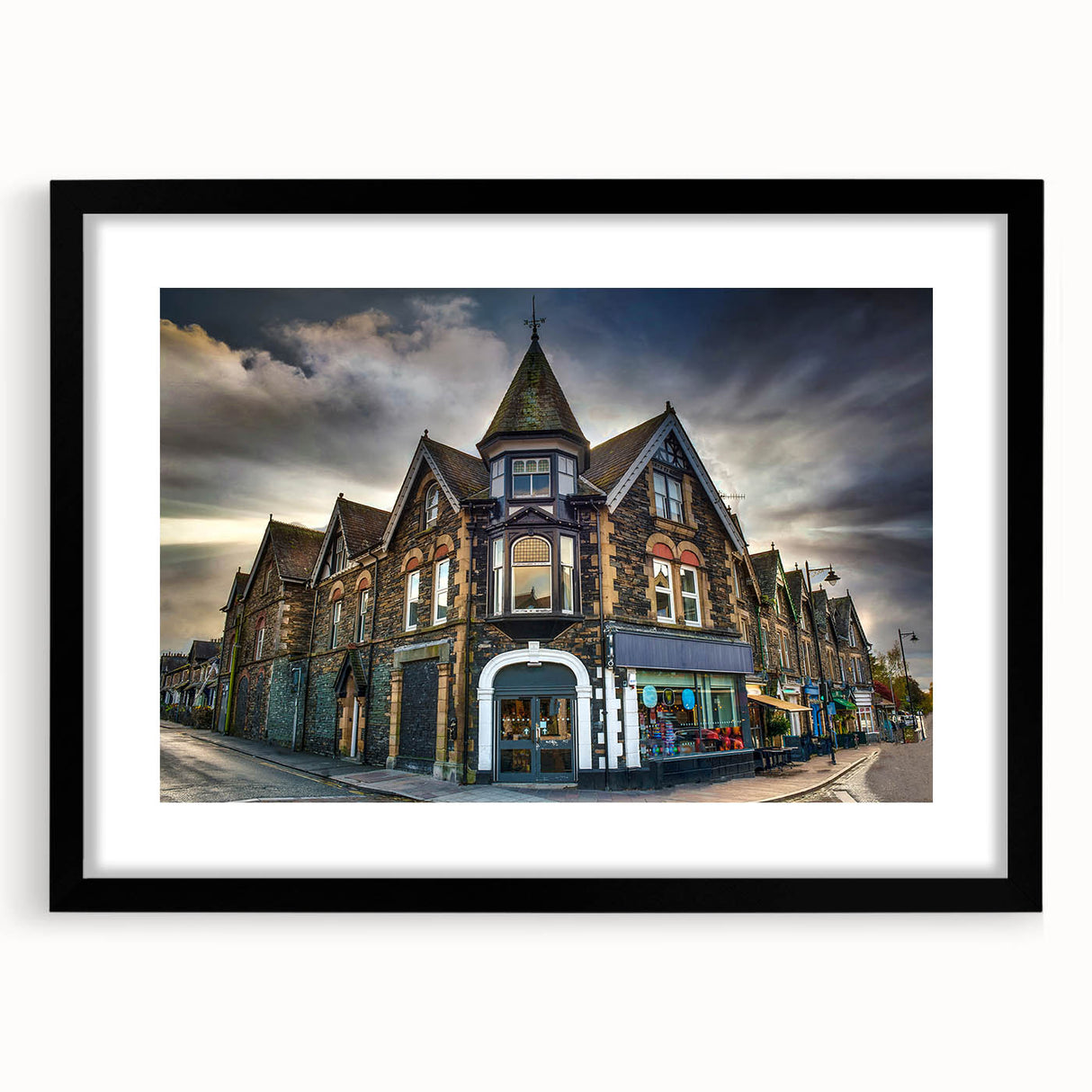 Extra large abstract art print of a colorful European Cumbrian landscape on textured canvas, framed in black.