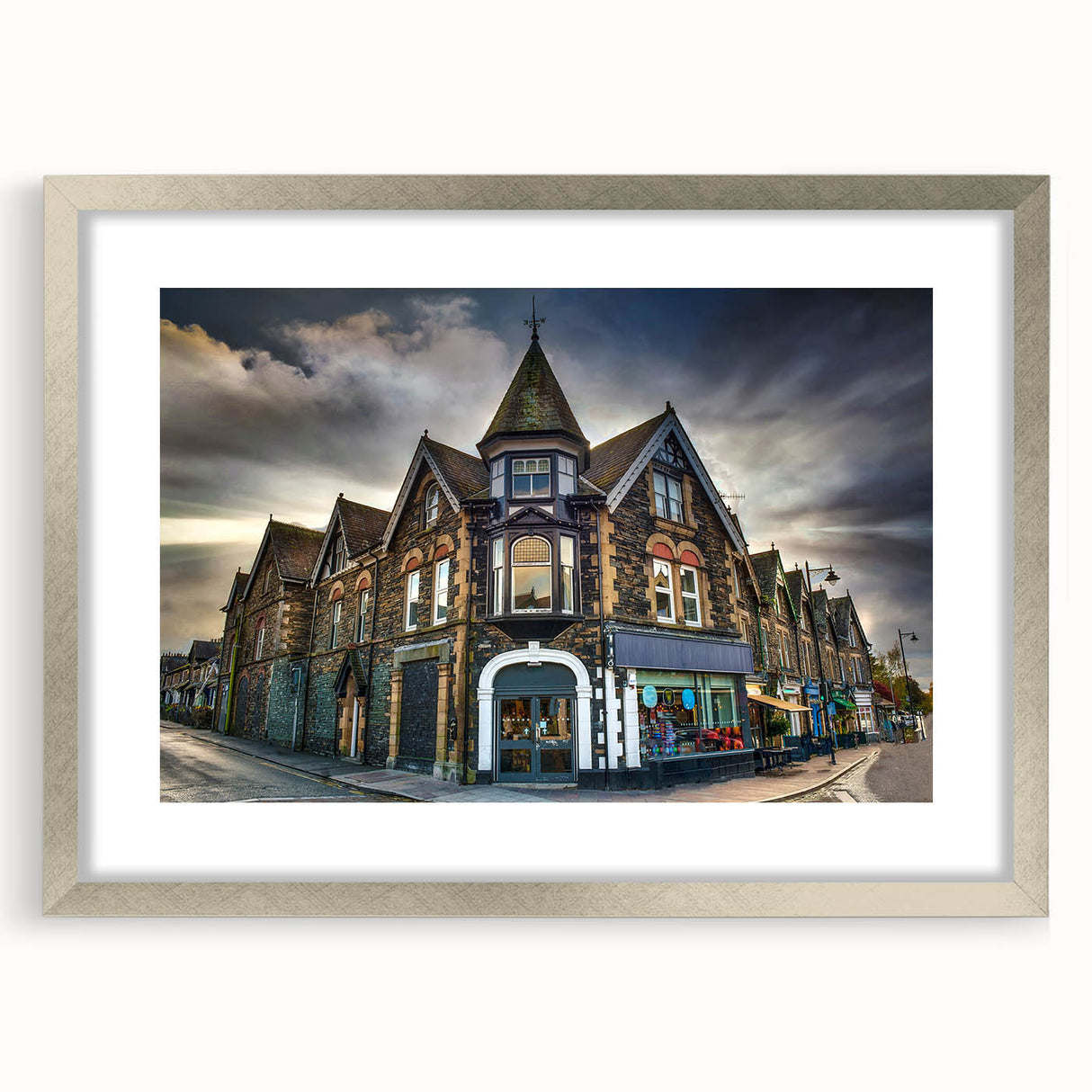 Extra large abstract art print depicting a textured scenery of Cumbria, England in muted earth tones, framed in silver.