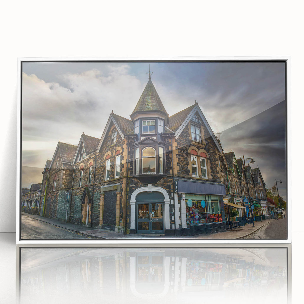 Mid-century modernist art depicting Cumbria's landscape in muted green and blue hues on a white-framed acrylic print.