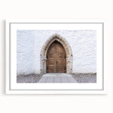 Textured abstract art print of a European scenery in muted earth tones, framed with a white mat, suitable for bedroom decor.