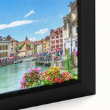 Black wall art featuring a textured depiction of the French Alps in vibrant colors on a framed canvas.