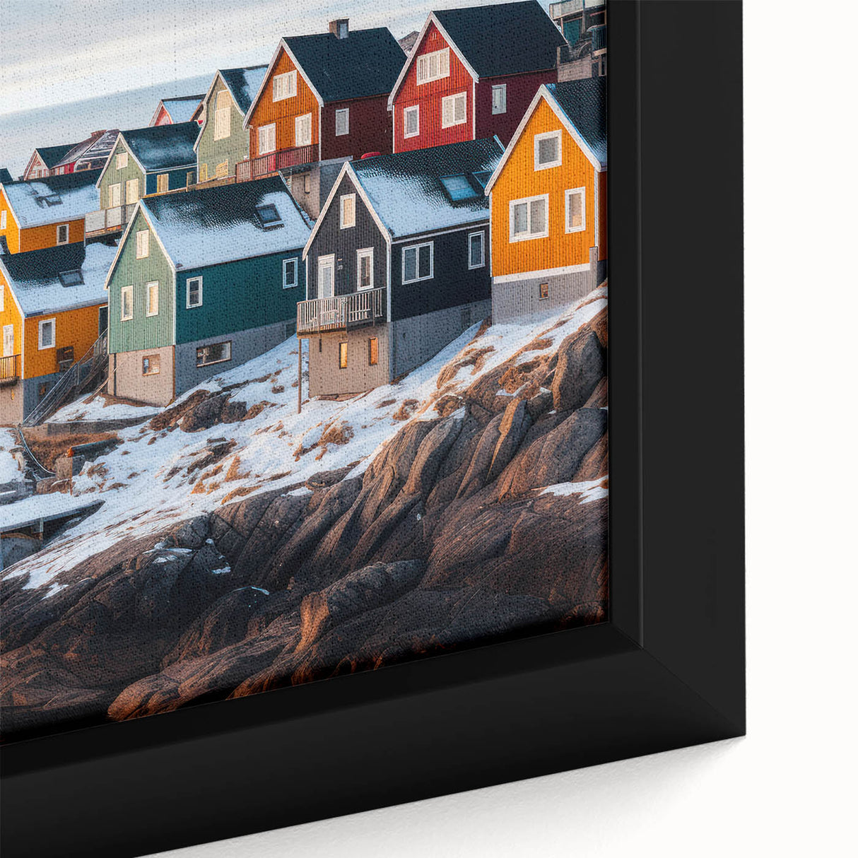 Close-up of black wall art featuring a textured Greenland landscape on framed canvas, with colorful accents.