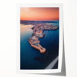 Rolled print of Sicilian landscape featuring lush greenery and distant mountains, in soft earth tones.