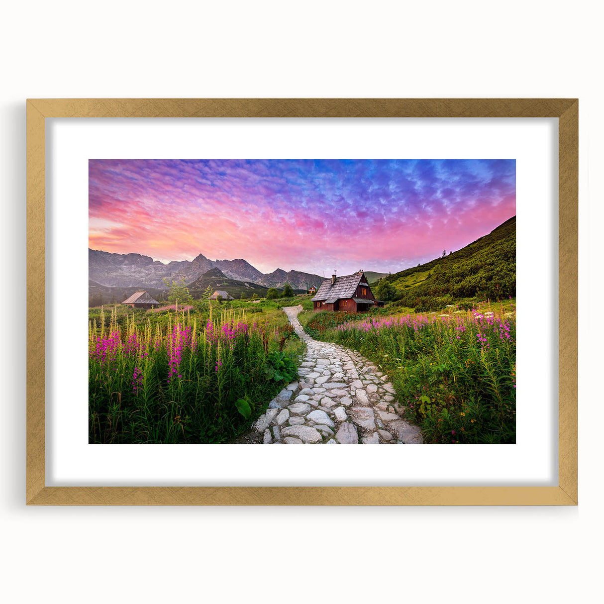 Abstract art print of a European landscape in muted gold and blue tones, framed with a gold mat.