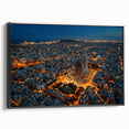 Black and white wall art featuring a vintage poster-style landscape of Barcelona on a framed canvas.