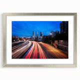 Textured abstract art print of Madrid scenery in muted earth tones, framed in silver, suitable for bedroom decor.