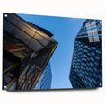 Large abstract wall art of Stockholm scenery in muted gray and blue tones on acrylic glass.