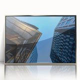 Mid-century modernist art depicting Stockholm scenery in muted blue and silver hues on a framed acrylic print.